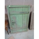 A vintage green painted pine cupboard door of plank Belgium design