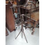 A 20th century stained frame music stand of spindle and turned form