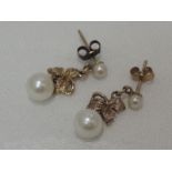 A pair of 9ct gold and cultured pearl stud earrings having leaf and pearl drops