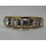 A lady's dress ring having five diamonds, total approx 1.25ct in 4 claw settings to stylised