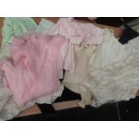 A box of vintage lingerie, girdles and nightwear. Mainly mid century, in nylon and various other