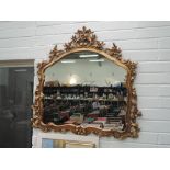 A modern gilt effect frame Roccoco style wall mirror