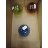 Three traditional glass fisherman's floats/witch balls of coloured smaller size