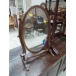 An early 20th century mahogany toilet/swing mirror having scroll frame