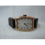 A gents vintage 9ct rose gold wrist watch having Arabic numeral dial with subsidiary seconds to a