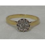 A lady's dress ring having a diamond solitaire, approx 0.3ct in an illusionary mount on an 18ct gold