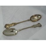 A pair of Victorian silver table spoons of fiddle back form with moulded decoration to terminals,