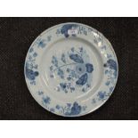 A 19th century Delft blue and white charger having foliate decoration