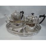 A silver plated four piece tea set by Walker and Hall having gadrooned and moulded floral