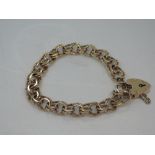 A 9ct gold double link bracelet having padlock clasp