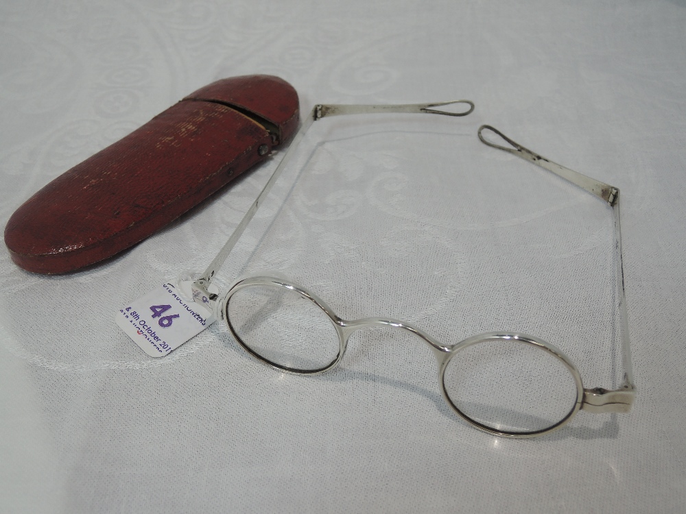 A cased pair of Georgian Britannia standard silver wig spectacles of traditional form, London