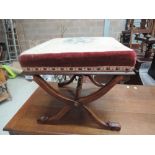 A 19th century part rosewood dressing stool having embroidered top and X frame