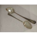 Two Georgian silver basting spoons of plain form, bearing monogram H to terminals, London 1783/1800,