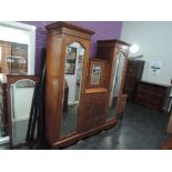 An Edwardian mahogany wardrobe having extensive line inlay decoration with central recess, having