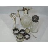 A selection of HM silver and white metal including bud vase, napkin rings, caster and glass jug with