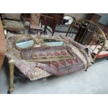 A 20th century reproduction brass double bedstead in the 19th century style having swag decoration