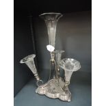 A Victorian silver plated epergne having four etched rippled glass trumpet vases on a shaped