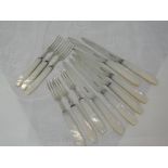 A set of six silver fruit knives and forks having mother of pearl handles, Sheffield 1936,