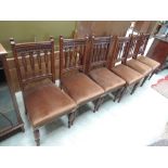 A set of six late Victorian mahogany dining chairs having slit slat backs, with later brown dralon