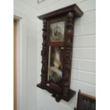 An early 20th century stained frame Vienna style wall clock having chrome dial, glass panel and half