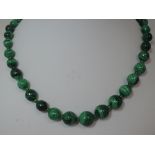 A string of malachite graduated spherical beads with white metal clasp, approx 22'