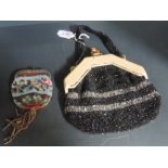 An intricate beaded handbag having bone handle or similar and a beaded coin purse , both good