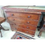 A 19th century mahogany chest of four long graduated cockbeaded drawers on pad feet