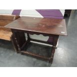 A 19th century oak side table in the 17th century style having rectangular top on baluster legs,