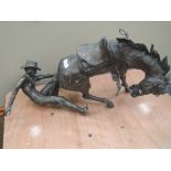 A cast bronzed figure modelled as American cowboy and horse
