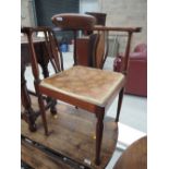 An Edwardian mahogany corner chair having chequered line inlay decoration with hour glass slats