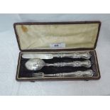 A cased child's Victorian silver three piece cutlery set having moulded decorative handles,