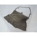 A lady's silver mesh evening bag having cream material lining, London 1915 Elkington & Co