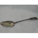A Georgian Irish silver straining spoon in the fiddle back pattern with central straining panel