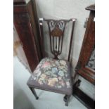 A late Victorian mahogany salon chair in the Art Nouveau style having inlay decoration and