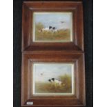 A pair of ceramic plaques by Crown Devon having painted gun dog pictorial decoration, signed by R