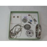 A small selection of HM silver and white metal jewellery including earrings, hinged bangle,