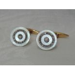 A pair of mother of pearl and diamond dress shirt cufflinks, each having a central brilliant-cut
