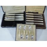Two cased part sets of HM silver handled butter knives and a set of six silver teaspoons of