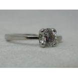 A lady's dress ring having a brilliant cut diamond solitaire, approx 0.5ct in a four claw setting on