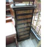 A 19th century Boulle cabinet having typical brass and tortoiseshell effect decoration and ormolu