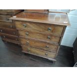 A 19th century mahogany small chest of four long cockbeaded drawers on bracket feet