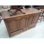 An 18th century oak mule chest having fielded panel sides, with three drawers under and additional