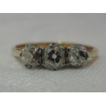 A lady's dress ring having a trilogy of old cut diamonds, total approx 0.6ct in a claw set mount