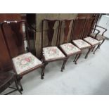 A selection of five early 20th century mahogany dining chairs in the Queen Anne style having vase
