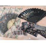Two beautiful oriental hand painted fans and a small selection of antique textiles and trims.