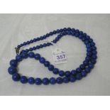 A string of Lapis lazuli graduated spherical beads with silver clasp, approx 16'