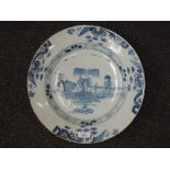 A 19th century Delf charger having pictorial blue and white decoration