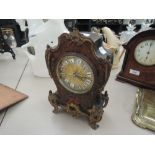 A 19th century French Roccoco clock having boule style decoration and ormolu effect applique