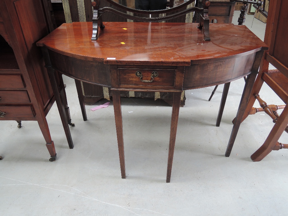 A late 19th century mahogany side table having shaped bow front with frieze drawer and square