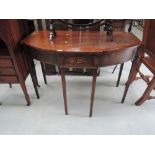 A late 19th century mahogany side table having shaped bow front with frieze drawer and square